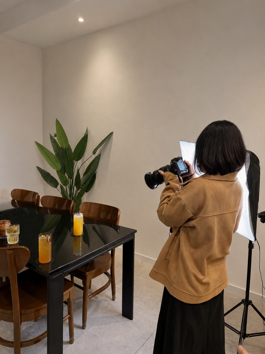A Bonnn photographer shooting a styled product photography session with studio lighting